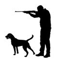 Hunter with dog aiming with his rifle silhouette. Outdoor hunting scene. Pointer looking on prey. Man hunting.