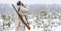 The hunter examines the winter forest through binoculars Royalty Free Stock Photo