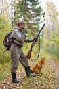 Hunter with a grouse call Royalty Free Stock Photo