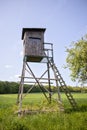 Hunter high stand, high hide beside a forest