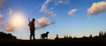 Hunter and his dog at dawn Royalty Free Stock Photo