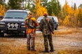 Hunter and his elkhound outdoor - hunting season Royalty Free Stock Photo