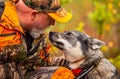 Hunter and his elkhound outdoor - hunting season Royalty Free Stock Photo