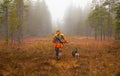 Hunter and his elkhound outdoor - hunting season Royalty Free Stock Photo