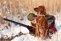 Hunter and his hunting dog looking for a hideout Royalty Free Stock Photo