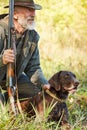 Hunter with his labrador in forest Royalty Free Stock Photo