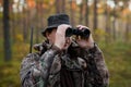 Hunter looking into binoculars