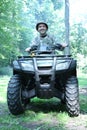Hunter man driving four wheel atv Royalty Free Stock Photo