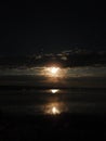 Hunter Moon in October sets on Cayuga Lake Ithaca NYS FingerLakes Royalty Free Stock Photo
