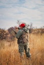 Hunter moving with shotgun looking for prey. Royalty Free Stock Photo