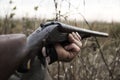 Hunter With Old Hunting Riffle Waiting for Pray in the Woods