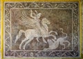 Hunter on a Pegasus horse with a spear. An ancient mosaic panel on the wall. Archaeological Museum in Rhodes, Greece