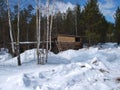 Hunter's hut in the Siberian taiga in the winter.