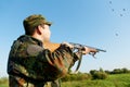 Hunter Shooting With Rifle Gun