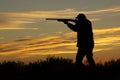 Hunter Shooting in Sunset Royalty Free Stock Photo