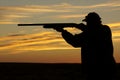 Hunter Shooting in Sunset Royalty Free Stock Photo