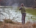 Hunter shooting ducks