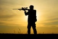 Hunter With Shotgun in Sunset Royalty Free Stock Photo