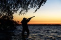 Hunter silhouette at sunset Royalty Free Stock Photo