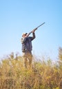 Hunter taking aim at the target. Royalty Free Stock Photo