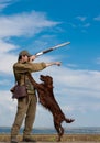 Hunter training his dog during a hunting party Royalty Free Stock Photo