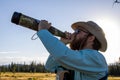 Hunter using a elk bugle mew call in snowy range mountains in Wyoming Royalty Free Stock Photo