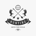 Hunters club with crossed arrows and attacking birds vector logo. Silhouette of elite organization professional shooters