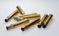 Hunting ammunition and empty rifle bullet cartridges on white. Royalty Free Stock Photo