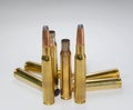 Hunting ammunition and empty rifle bullet cartridges on white. Royalty Free Stock Photo