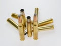 Hunting ammunition and empty rifle bullet cartridges on white. Royalty Free Stock Photo