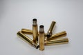 Hunting ammunition and empty rifle bullet cartridges on white. Royalty Free Stock Photo