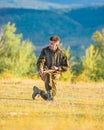 Hunting as male hobby and leisure. Hunter khaki clothes ready to hunt hold gun mountains background. Hunting shooting Royalty Free Stock Photo