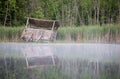 Hunting Blind Reflected In Misty Early Morning Water