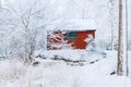 Hunting cabin in a winter forest Royalty Free Stock Photo