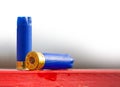 Hunting cartridge blue used lies on the red table