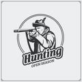 Hunting club emblem. Hunter with a gun.