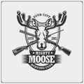 Hunting club emblem with moose or elk and crossed rifles.