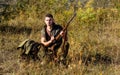 Hunting equipment concept. Hunter with rifle looking for animal. Hunter khaki clothes ready to hunt nature background