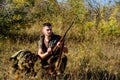 Hunting equipment concept. Hunting hobby and leisure. Hunter with rifle looking for animal. Hunter khaki clothes ready