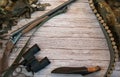 The frame is made of a hunting weapon, a knife in a case, binoculars and a bandolier with cartridges on a wooden background. Royalty Free Stock Photo