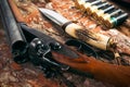 Hunting equipment on old wooden background