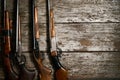 Hunting guns frame on wooden table Royalty Free Stock Photo