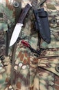 Hunting knife and flint for a fire. Hunting camouflage