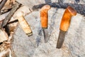 Hunting knives thrust in tree stump Royalty Free Stock Photo