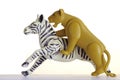 Hunting lion on a zebra plastic toy Royalty Free Stock Photo