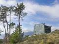 Hunting lodge camouflaged on top of a hill in the wild Royalty Free Stock Photo