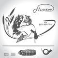 Hunting logo hunting dog with a wild duck in his teeth and design elements. The outfit of the hunter. Royalty Free Stock Photo