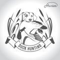 Hunting logo hunting dog with a wild duck in his teeth and design elements. The outfit of the hunter. 2 Royalty Free Stock Photo
