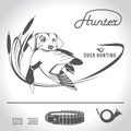 Hunting logo hunting dog with a wild duck in his teeth and design elements. The outfit of the hunter.3 Royalty Free Stock Photo