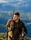 Hunting period. Male with a gun. Hunter with hunting gun and hunting form to hunt. Shooter sighting in the target. The Royalty Free Stock Photo